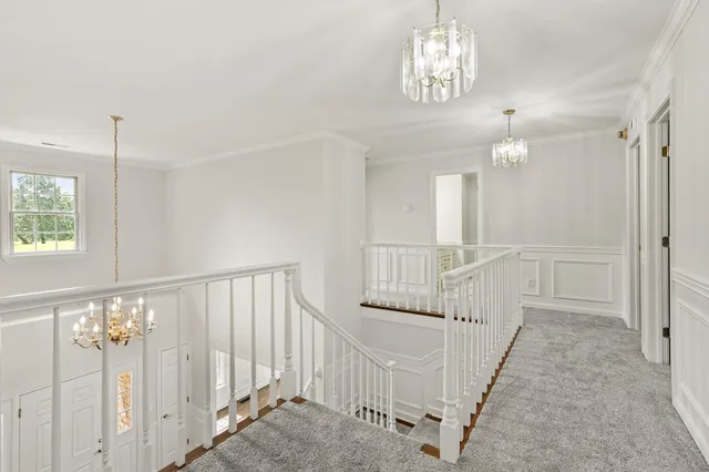 a view of a balcony with wooden floor and fence