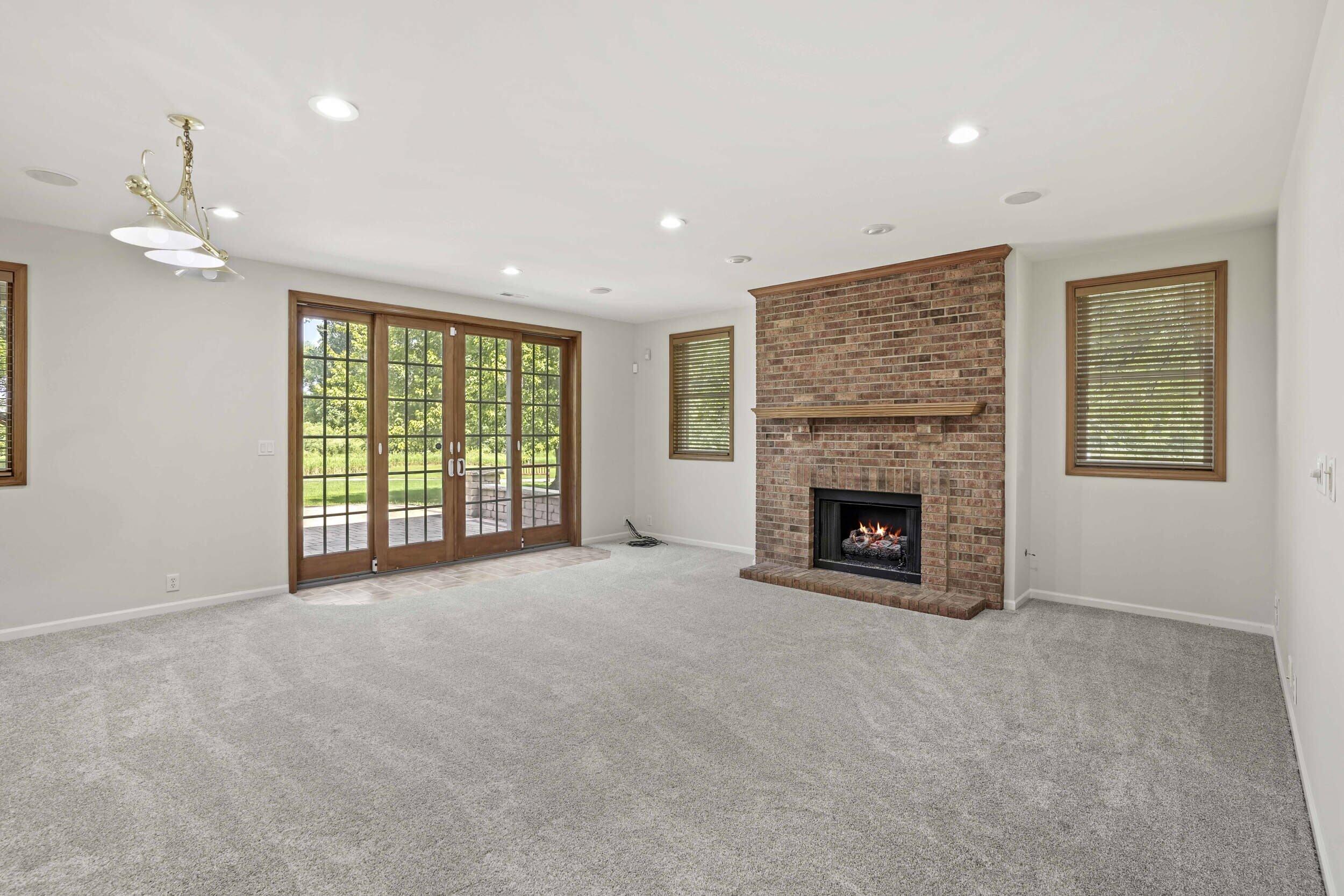 1500 Nelson Drive Chesterton, IN 46304 - Photo 45 of 70 a view of an empty room with a fireplace and a window