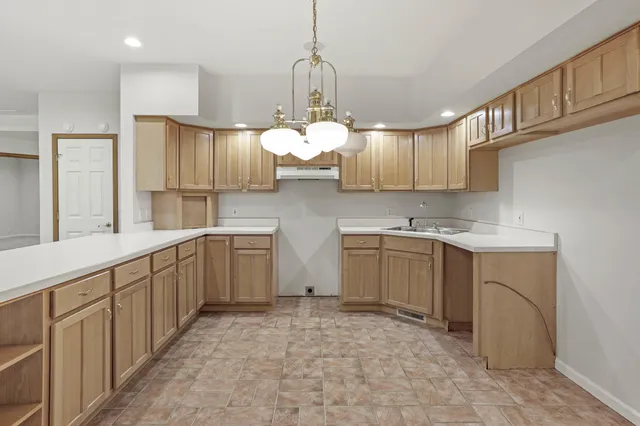 an aerial view of a residential houses with outdoor space