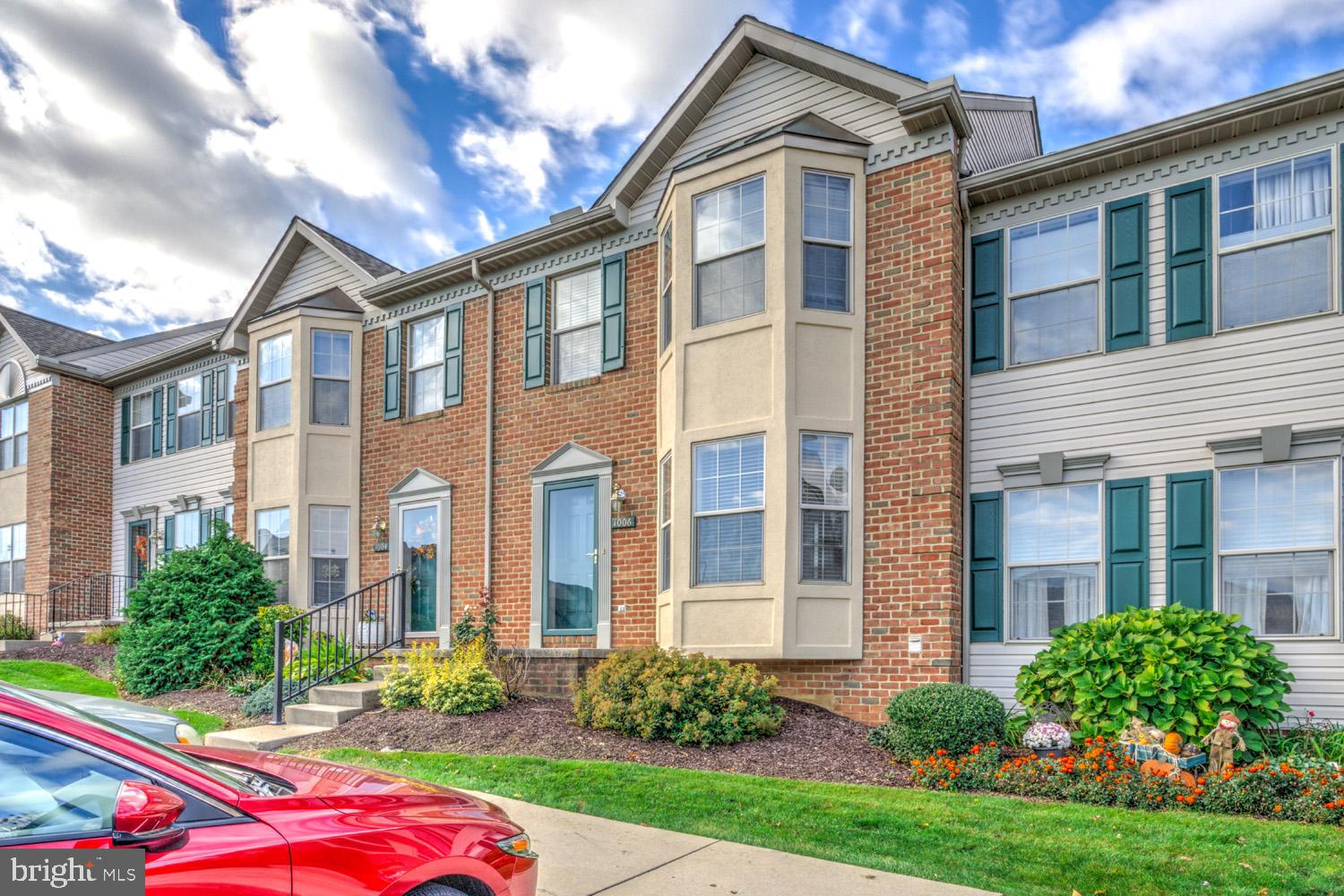 1006 Cobblestone Lane Lancaster, PA 17601 - Photo 2 of 38 a front view of a house with garden