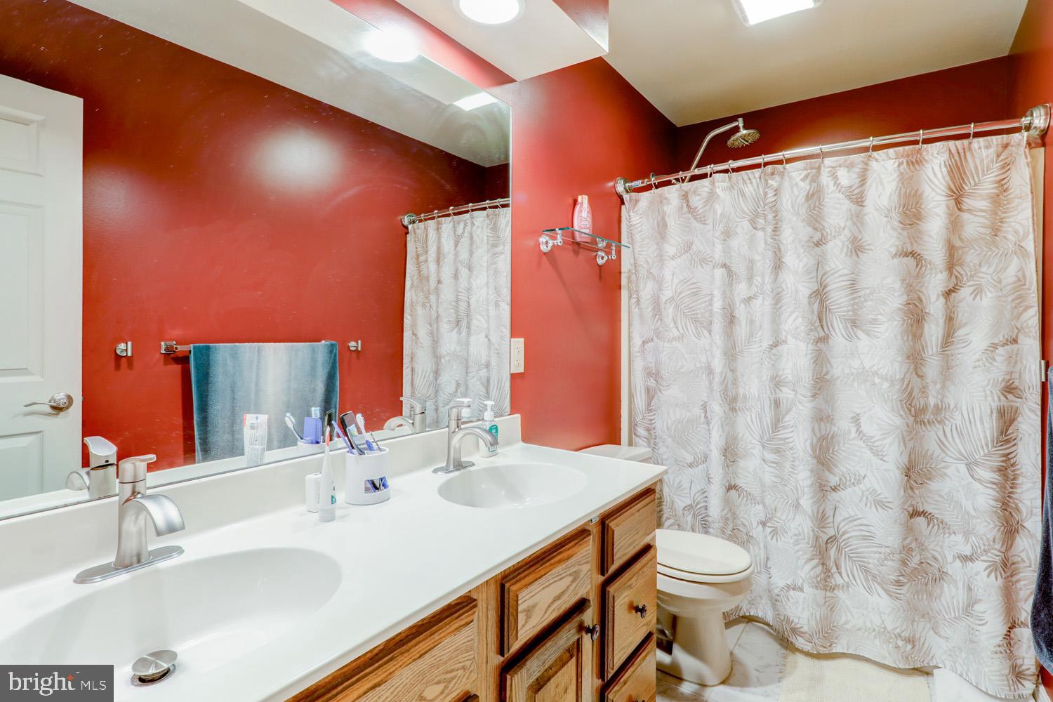 1006 Cobblestone Lane Lancaster, PA 17601 - Photo 25 of 38 a bathroom with a sink and a mirror