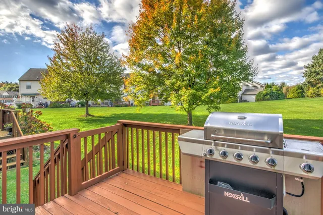 a view of a wooden deck and a yard