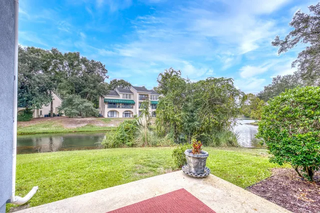 a view of a patio with a table chairs and a table