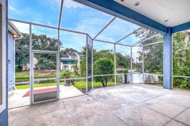 a view of an empty room with glass door