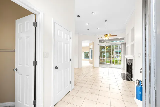 a dining room with furniture a fireplace and a chandelier