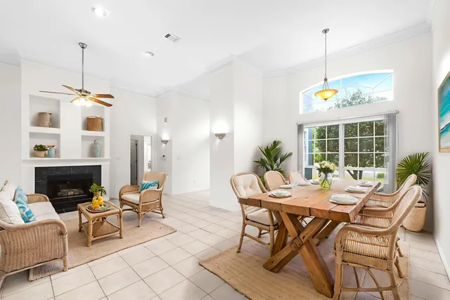 a view of an empty room with a fireplace and a window