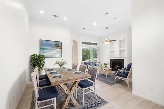 a view of an empty room with window and fire place
