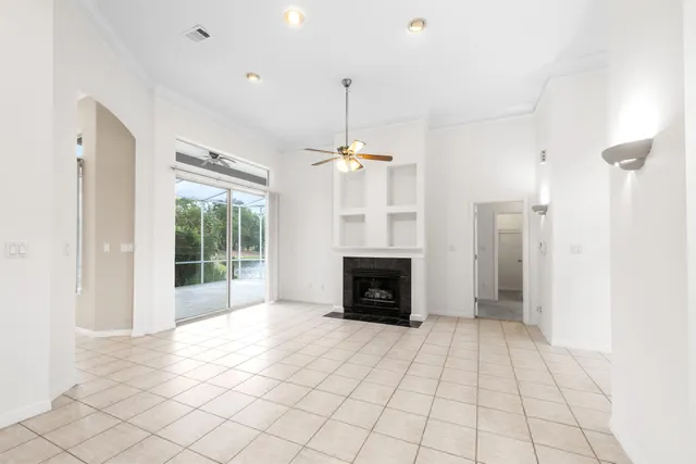 a large kitchen with a stove sink and cabinets