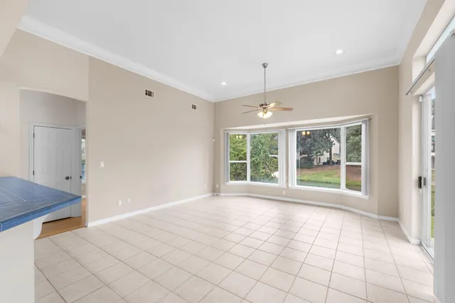a kitchen with stainless steel appliances a refrigerator and a stove top oven