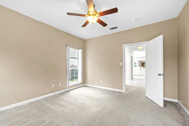 a view of living room kitchen with windows