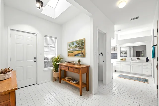 a bathroom with a granite countertop toilet a sink and a bathtub