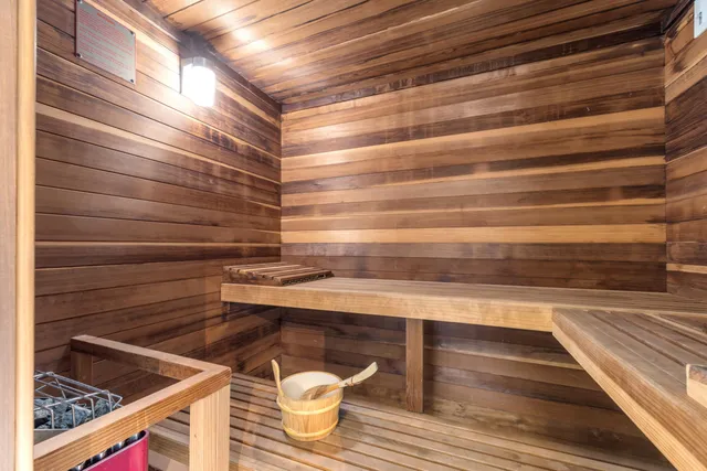 a bathroom with a glass door shower