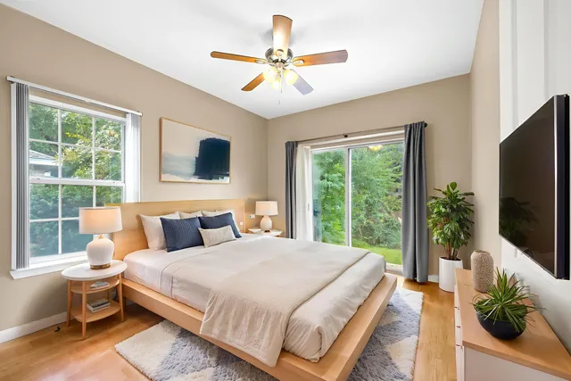 a bathroom with a sink mirror toilet and shower