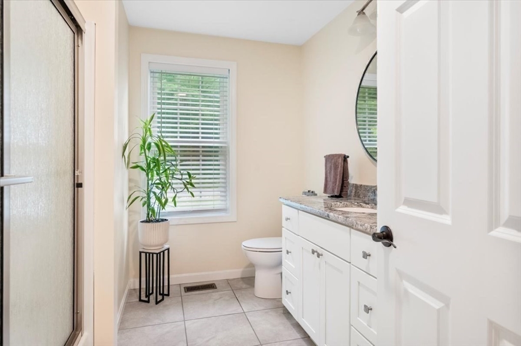 1085 Southbridge Road Warren, MA 01585 - Photo 17 of 31 a bathroom with a toilet sink and mirror