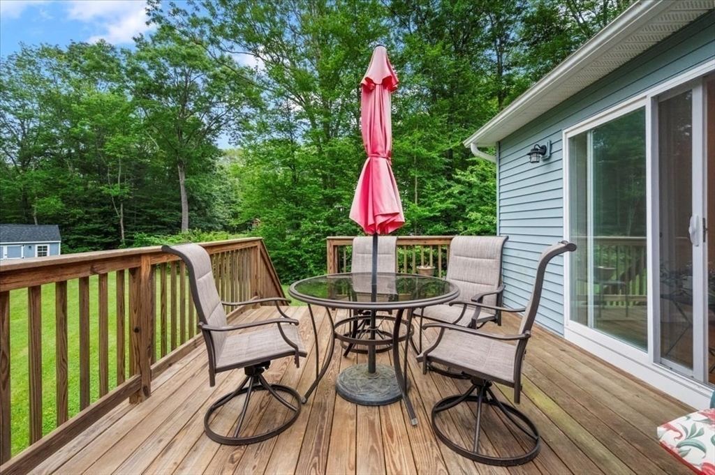 1085 Southbridge Road Warren, MA 01585 - Photo 24 of 31 a view of a chair and tables in the balcony