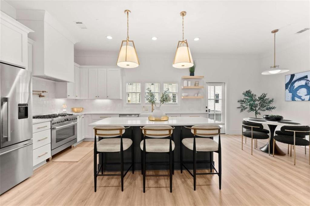 338 Sugarview Road Sugar Hill, GA 30518 - Photo 12 of 74 a dining room filled chandelier and wooden floor