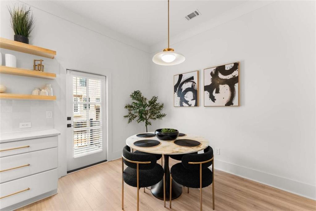 338 Sugarview Road Sugar Hill, GA 30518 - Photo 16 of 74 a view of a workspace with furniture and wooden floor