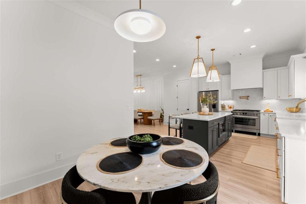 338 Sugarview Road Sugar Hill, GA 30518 - Photo 17 of 74 a kitchen with a sink a stove and cabinets