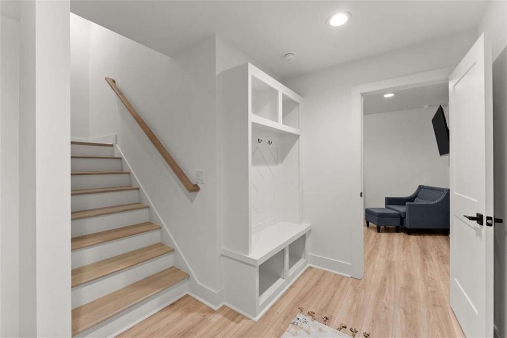 338 Sugarview Road Sugar Hill, GA 30518 - Photo 23 of 74 a view of entryway and hall with wooden floor