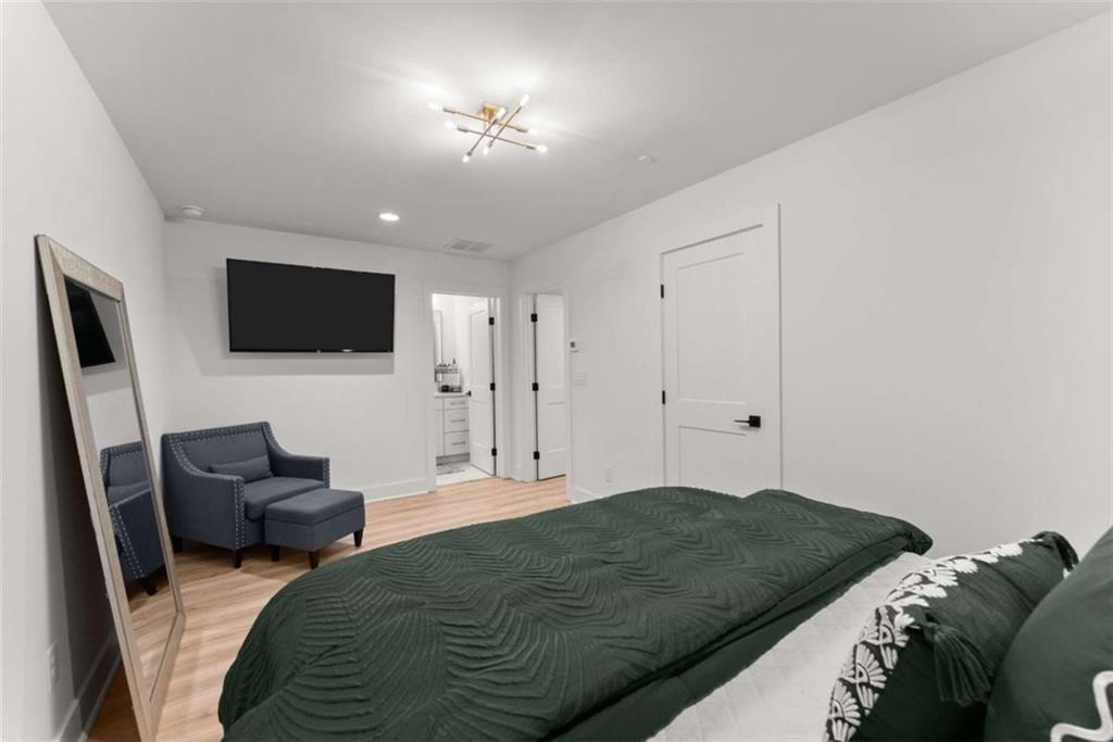 338 Sugarview Road Sugar Hill, GA 30518 - Photo 25 of 74 a bedroom with a bed window and a television