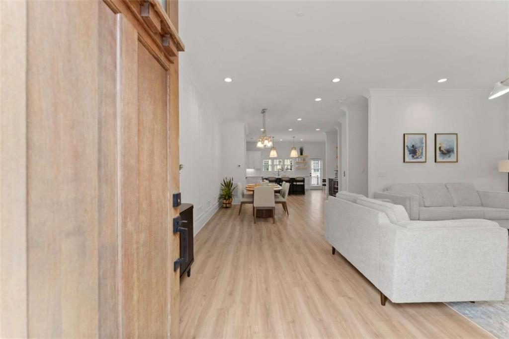 338 Sugarview Road Sugar Hill, GA 30518 - Photo 3 of 74 a living room with furniture and a wooden floor