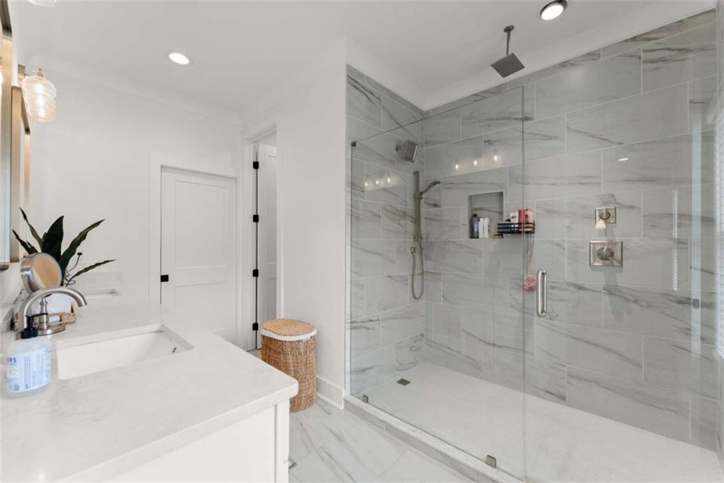 338 Sugarview Road Sugar Hill, GA 30518 - Photo 32 of 74 a bathroom with a bathtub and a shower