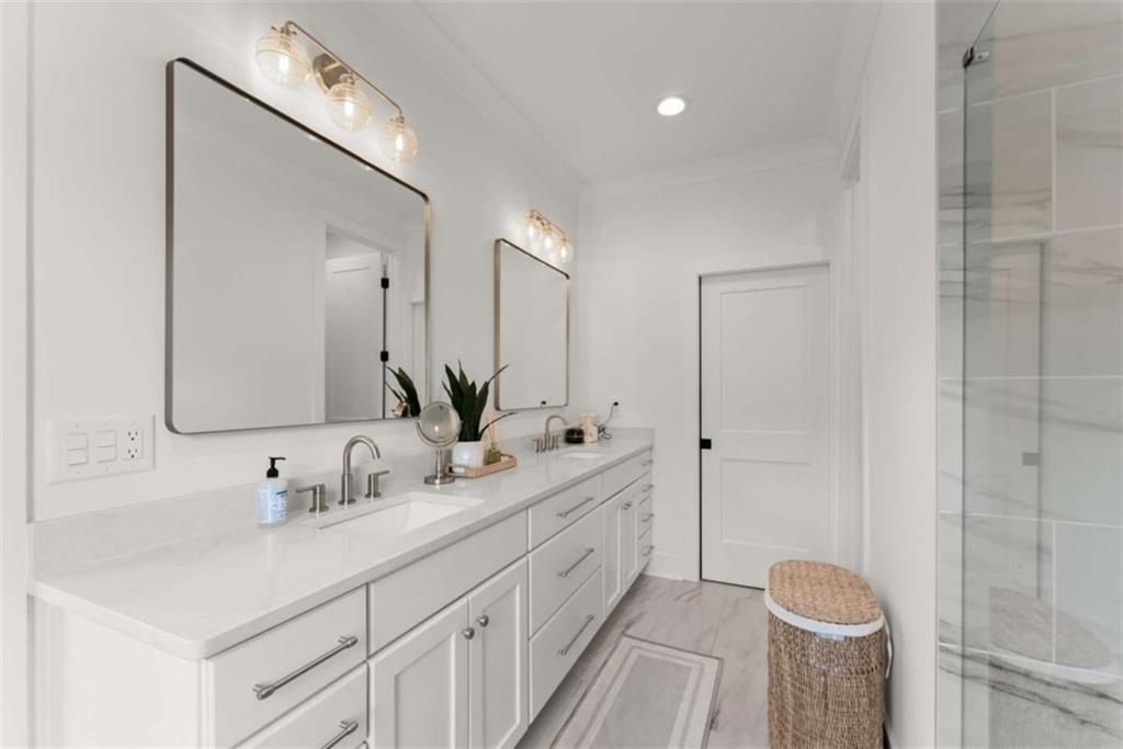 338 Sugarview Road Sugar Hill, GA 30518 - Photo 33 of 74 a bathroom with a double vanity sink mirror and shower