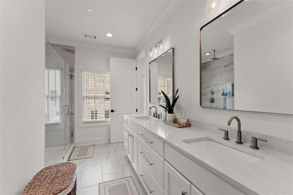 338 Sugarview Road Sugar Hill, GA 30518 - Photo 35 of 74 a bathroom with a double vanity sink mirror and