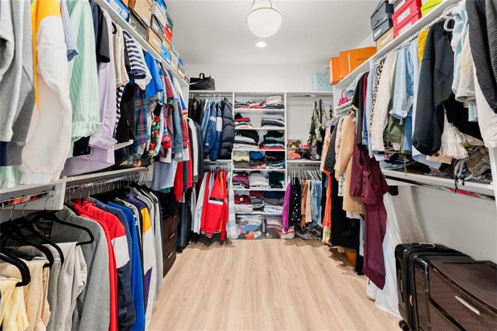 338 Sugarview Road Sugar Hill, GA 30518 - Photo 36 of 74 a view of walk in closet with clothes