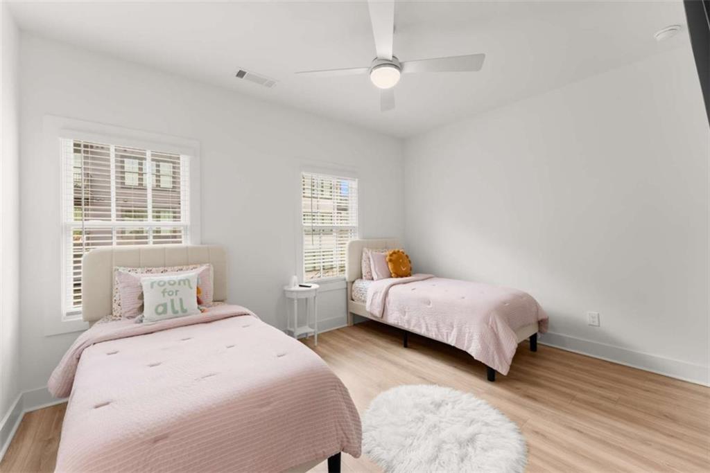 338 Sugarview Road Sugar Hill, GA 30518 - Photo 37 of 74 a bedroom with two beds and a window