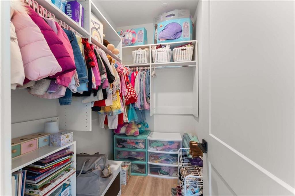 338 Sugarview Road Sugar Hill, GA 30518 - Photo 39 of 74 a view of walk in closet with clothes and shoes