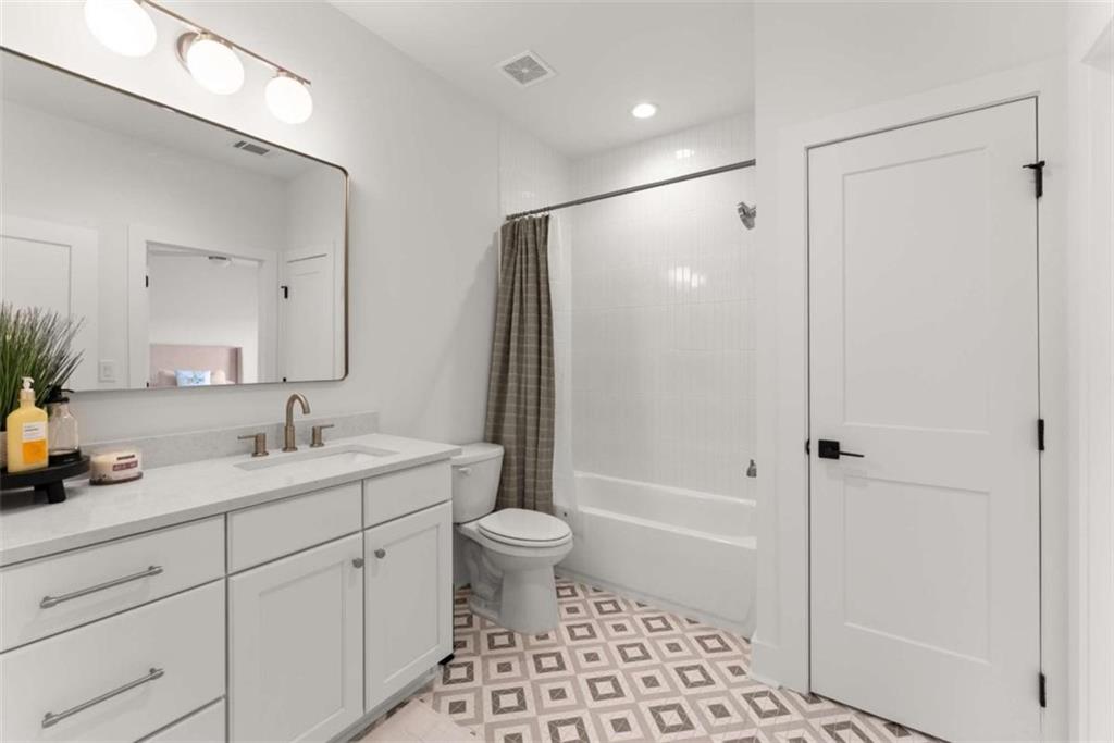 338 Sugarview Road Sugar Hill, GA 30518 - Photo 45 of 74 a bathroom with a sink a toilet and shower