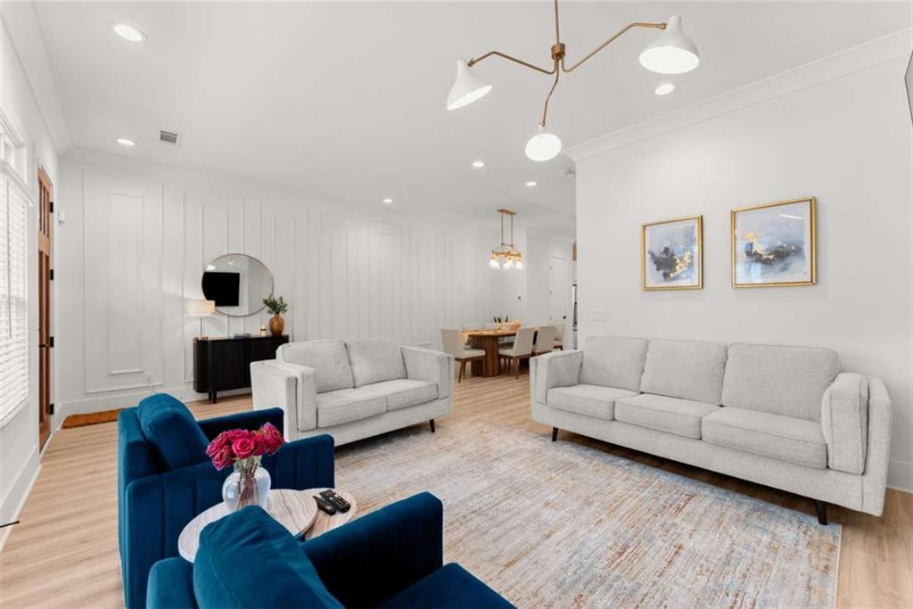 338 Sugarview Road Sugar Hill, GA 30518 - Photo 6 of 74 a living room with furniture and wooden floor