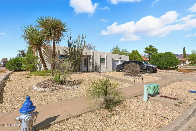 a view of a water fountain in front of a house