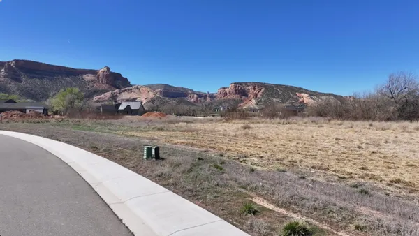 a view of a town with mountains in the background