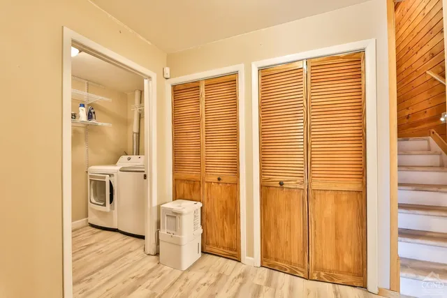 a bathroom with a toilet a sink and a window