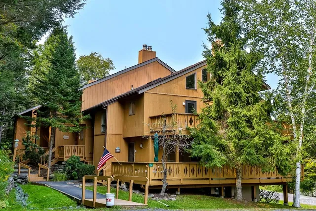 a view of a balcony with wooden floor