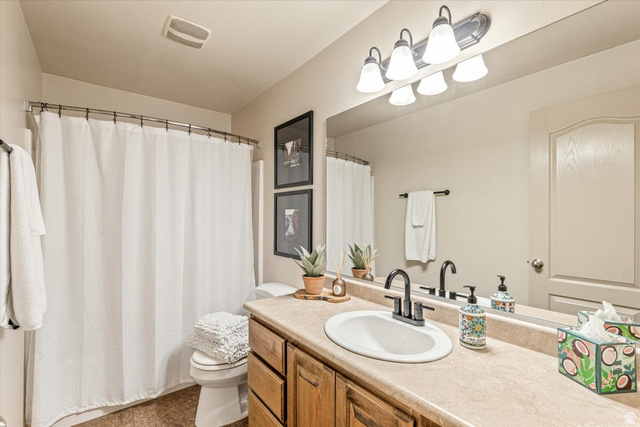 345 North 2450th Street East, Unit 152 St. George, UT 84790 - Photo 27 of 40 Bathroom featuring vanity and a shower with curtain