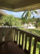 a view of swimming pool from a balcony