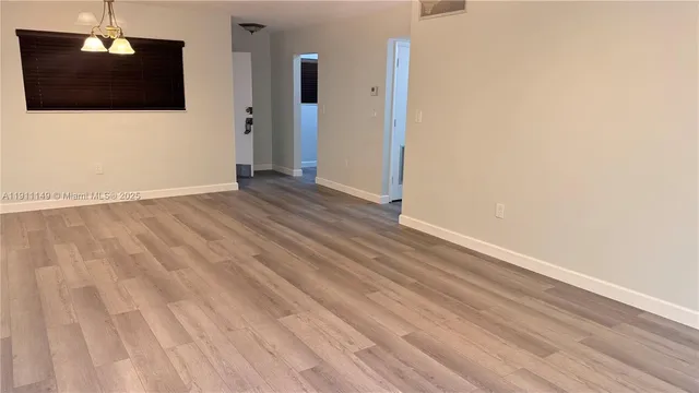 a view of a livingroom with wooden floor