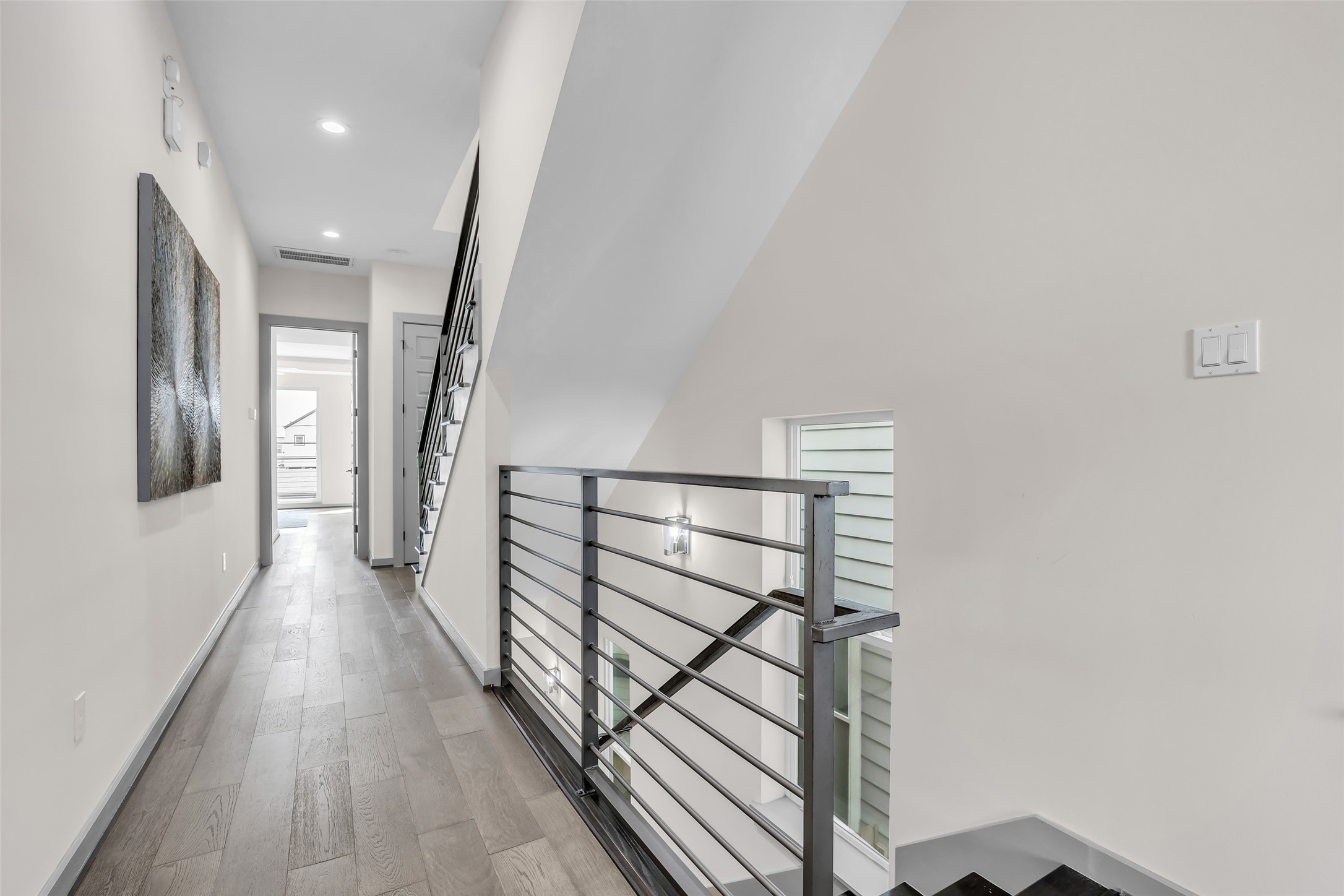 1207 East 28th Street Houston, TX 77009 - Photo 28 of 38 a view of a hallway with wooden floor and staircase
