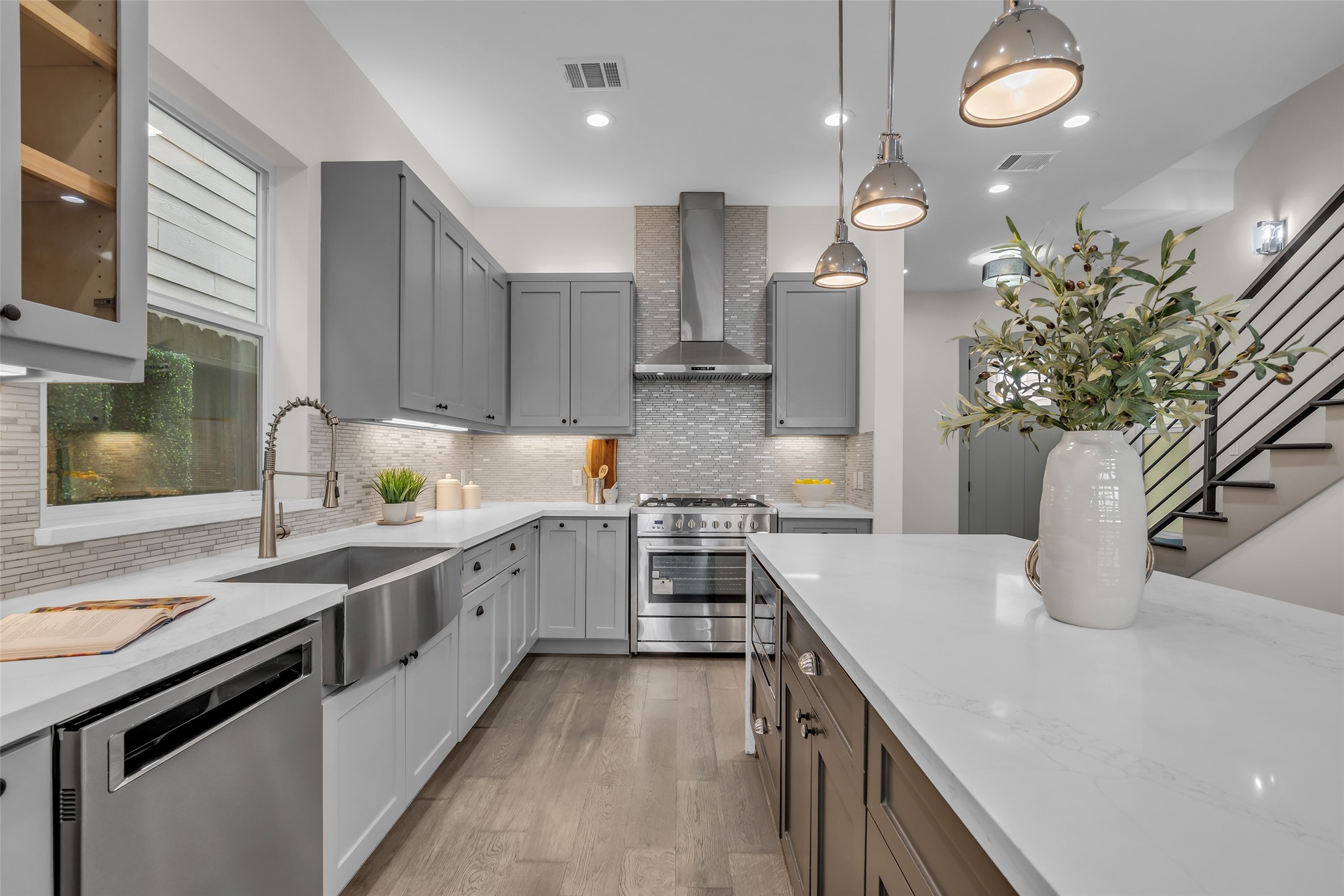 1207 East 28th Street Houston, TX 77009 - Photo 9 of 38 a kitchen with a sink stove and cabinets