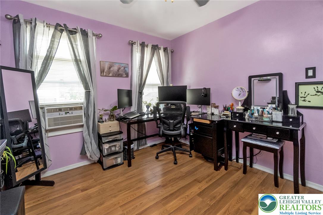 365 Rock Street Easton, PA 18042 - Photo 28 of 50 Well-lit room featuring warm wood flooring, offering an ideal space for a productive home office.