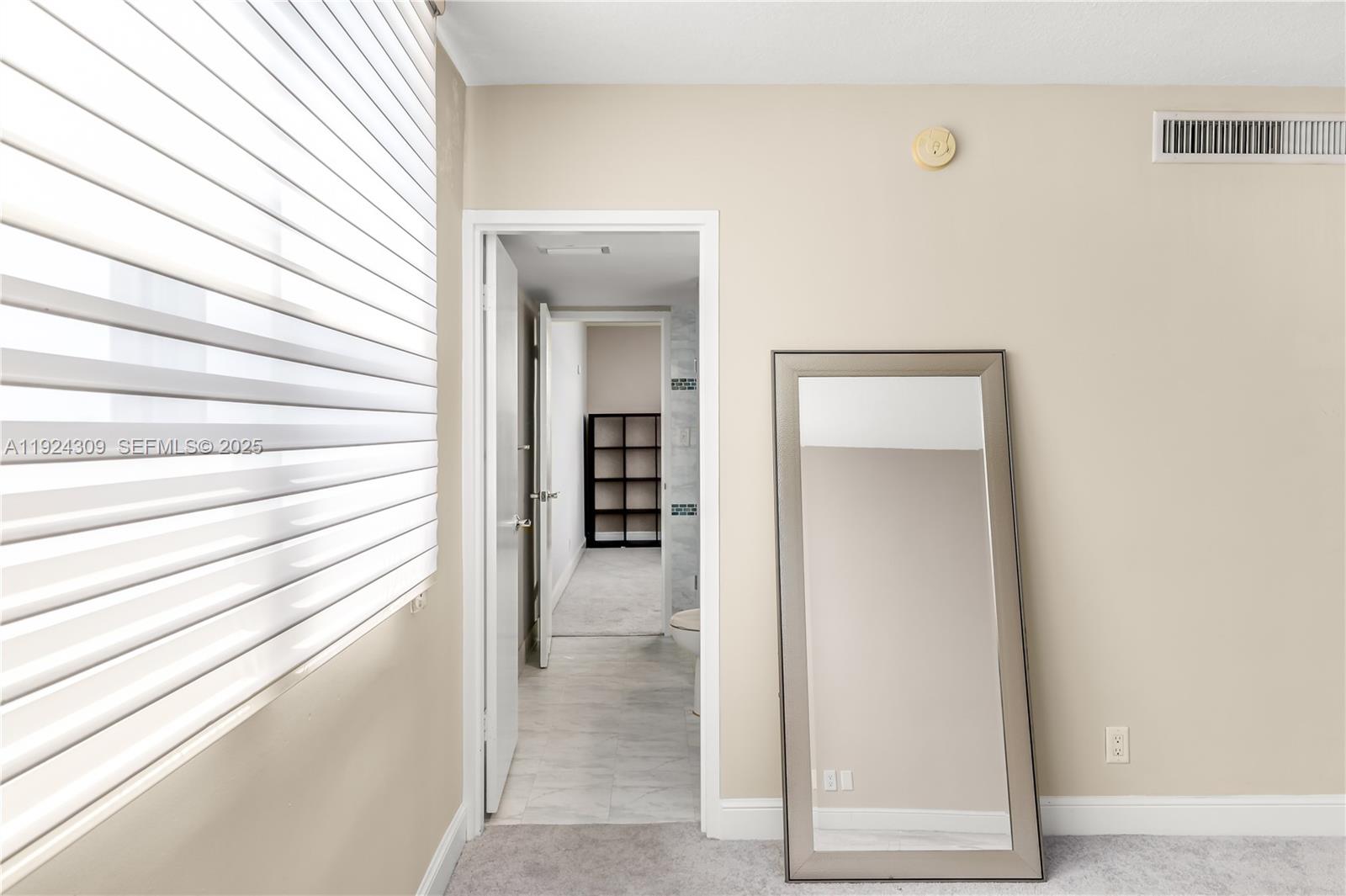 9225 Collins Avenue, Unit 612 Surfside, FL 33154 - Photo 12 of 38 a view of a hallway with closet and bathroom