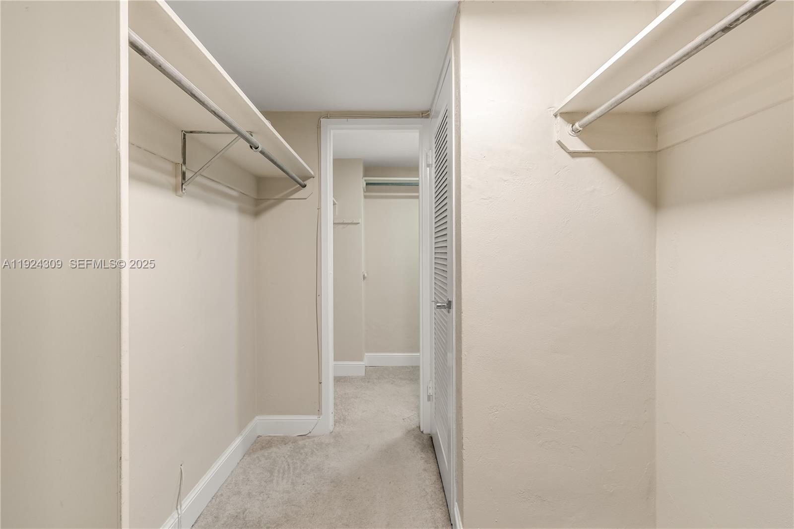 9225 Collins Avenue, Unit 612 Surfside, FL 33154 - Photo 19 of 38 a view of walk in closet