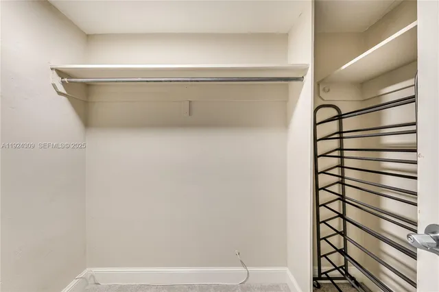 a view of an empty walk in closet