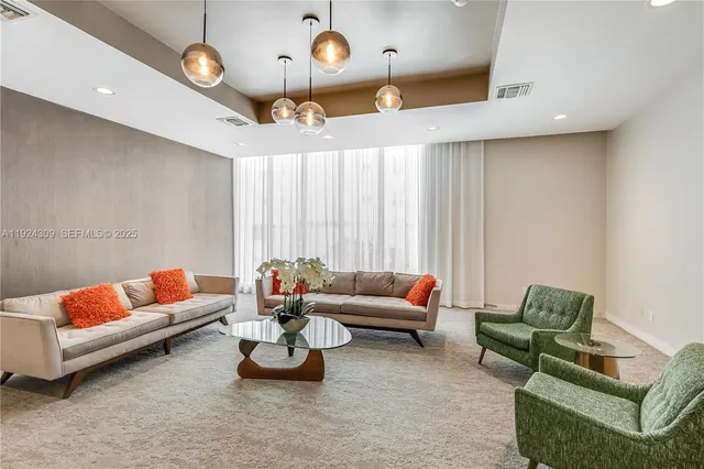 a view of a yard with plants and trees