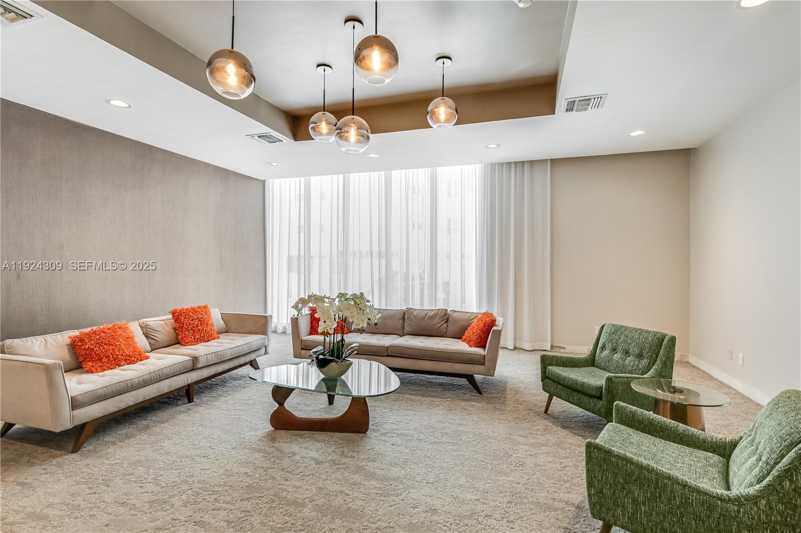 9225 Collins Avenue, Unit 612 Surfside, FL 33154 - Photo 32 of 38 a living room with furniture and a large window