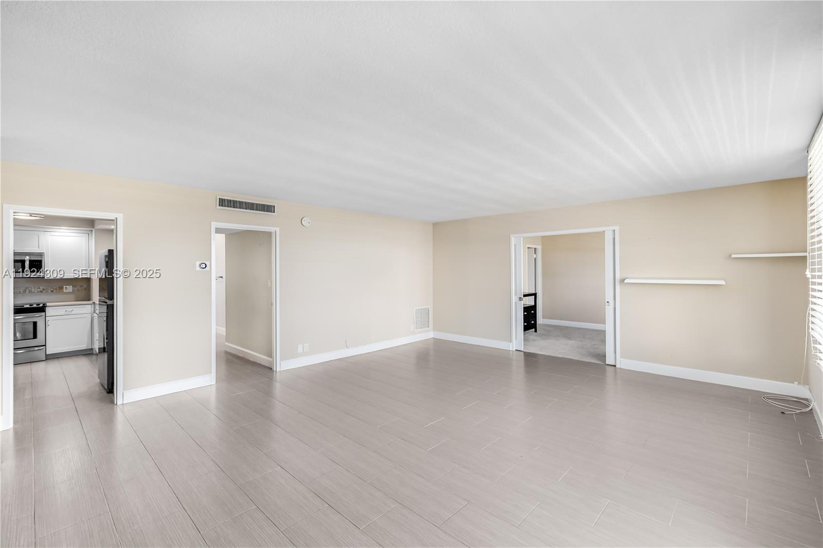 9225 Collins Avenue, Unit 612 Surfside, FL 33154 - Photo 6 of 38 wooden floor in an empty room