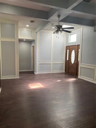 a view of a livingroom with wooden floor